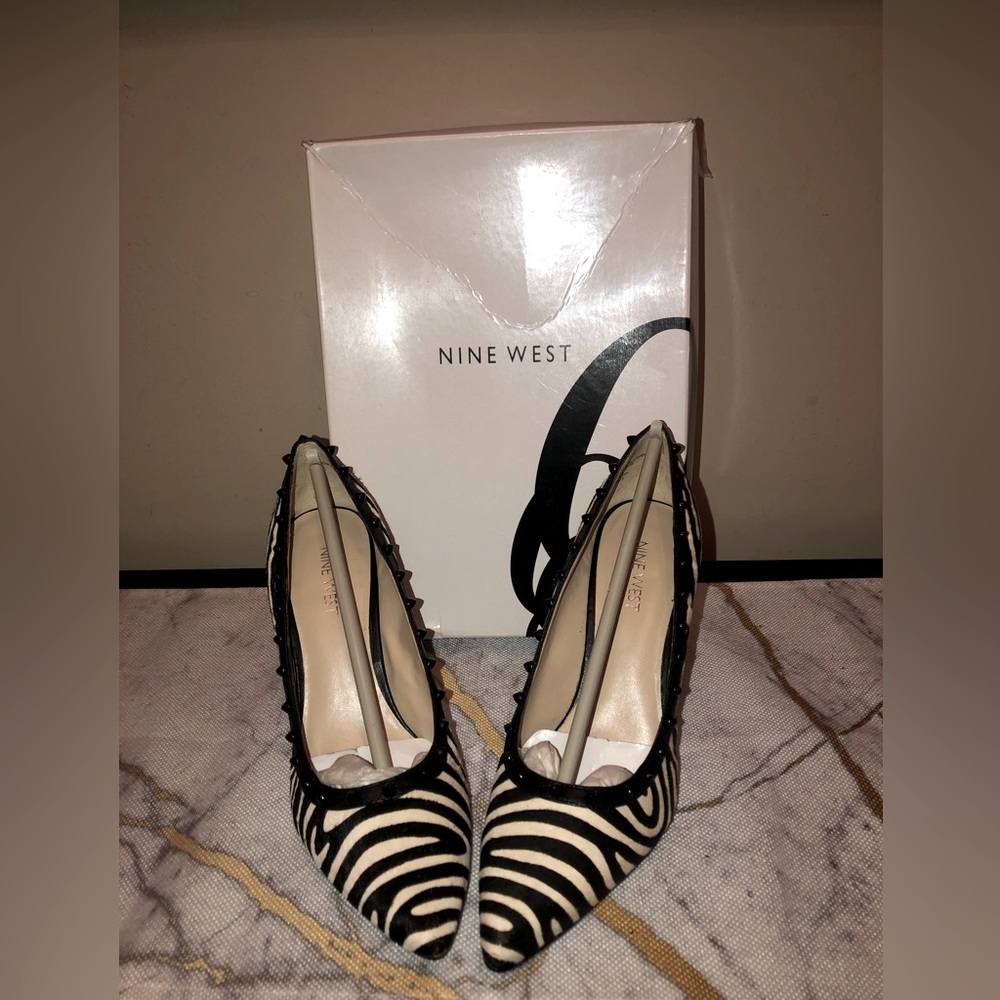Nine West; black and off white; very pretty pumps; great for the work place;